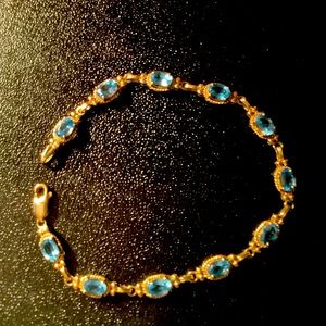 14k gold blue topaz tennis  7 inch bracelet. Excellent cond